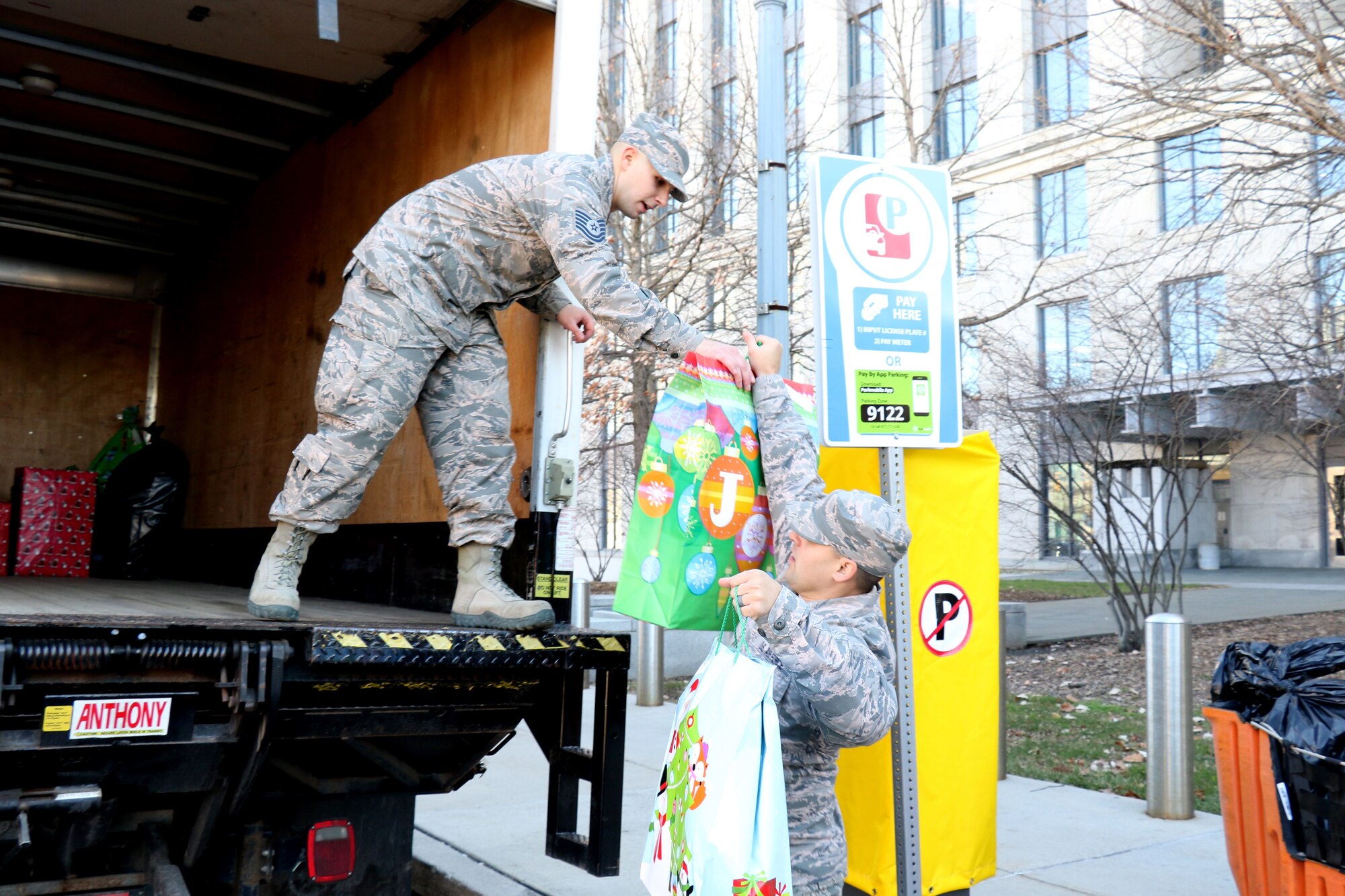 As part of the 28th annual Holiday Wish Program, 193rd Regional Support Group Airmen and Pennsylvania Army Guardsmen with the help of volunteer state employees, load donated gifts into military vehicles at the Keystone Building, Harrisburg, Pennsylvania, Dec. 6, 2017. The donated gifts were delivered to participating county assistance offices for distribution to families and individuals.  (U.S. Air National Guard photo by Master Sgt. Culeen Shaffer/Released)