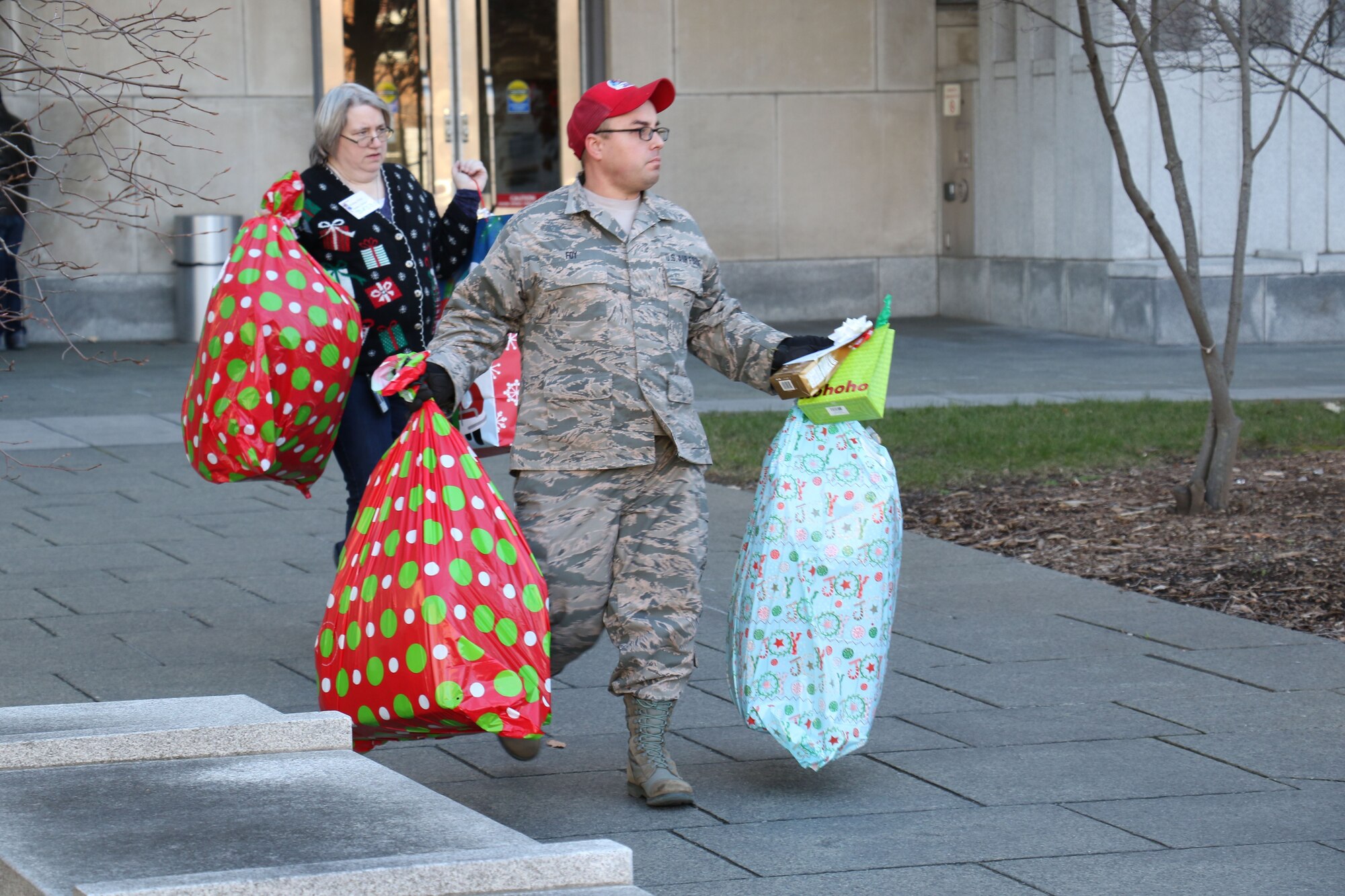 As part of the 28th annual Holiday Wish Program, Tech. Sgt Kevin Foy, 201st RED HORSE Squadron, along with other Pennsylvania Guardsmen and with the help of volunteer state employees, load donated gifts into military vehicles at the Keystone Building, Harrisburg, Pennsylvania, Dec. 6, 2017. The donated gifts were delivered to participating county assistance offices for distribution to families and individuals.  (U.S. Air National Guard photo by Master Sgt. Culeen Shaffer/Released)