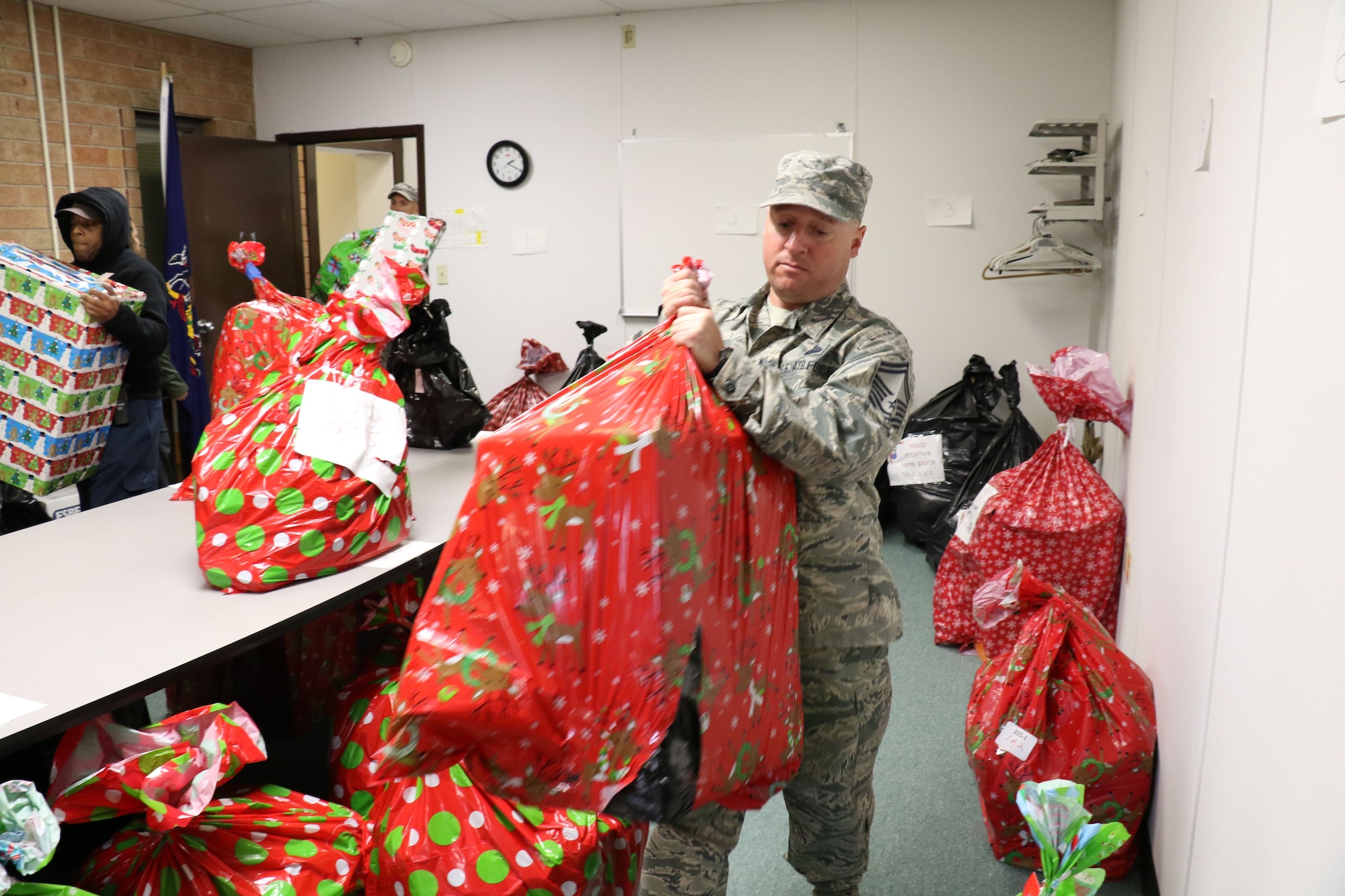 Senior Master Sgt. Matthew Mannion, 271st Combat Communications Squadron, unloads donated gifts at the Lebanon County assistance office, Lebanon, Pennsylvania, Dec. 6, 2017. The gifts were from 28th annual Holiday Wish Program gift drive and will be distributed to families and individuals in need. (U.S. Air National Guard photo by Master Sgt. Culeen Shaffer/Released)
