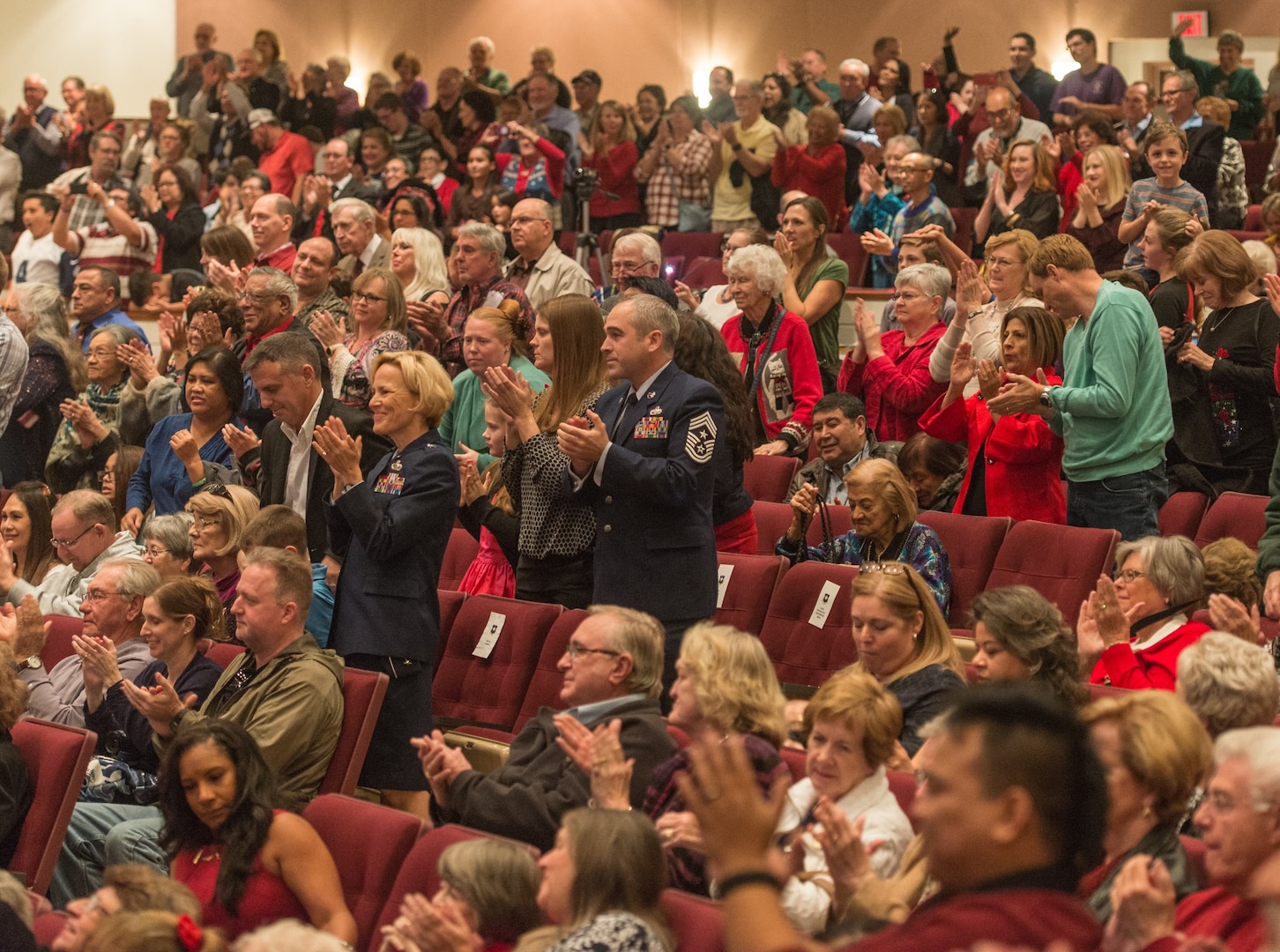 The audience shows its approval as the U.S. Air Force Band of the West and the 323rd Army Band "Fort Sam's Own" team up for a "Holiday in Red, White and Blue" concert Dec. 10, 2017 at the Edgewood Performing Arts Center, 402 Lance St., in San Antonio. The annual performance is free and open to the public and is a holiday tradition.