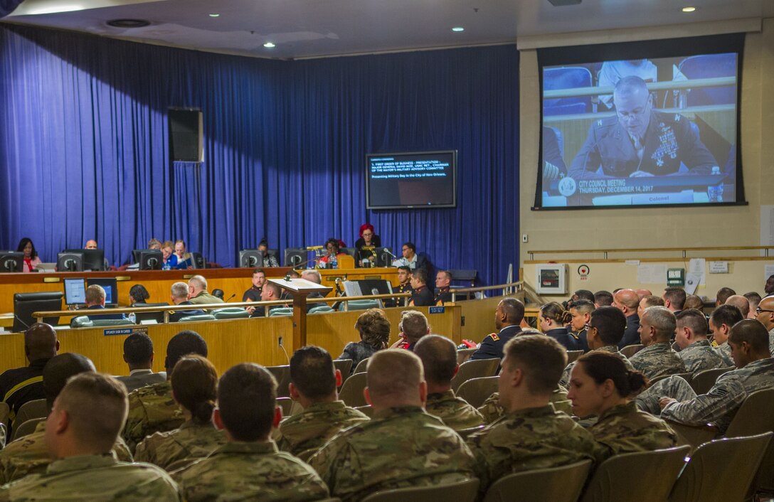 Service members listen to Col. Gerry W. Leonard, chief of staff of Marine Forces Reserve, as he discusses the achievements of Marine Forces Reserve at the New Orleans City Hall, Dec. 14, 2017.