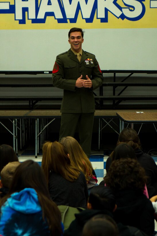 Sgt. Charles Bump, range safety officer, Marksmanship Training Unit, answers students’ ques-tions during a question-and-answer event at Friendly Hills Elementary School in Joshua Tree, Calif., Dec. 7, 2017. This is the first year the event took place at Friendly Hills. (U.S. Marine Corps photo by Pfc. Rachel K. Porter)