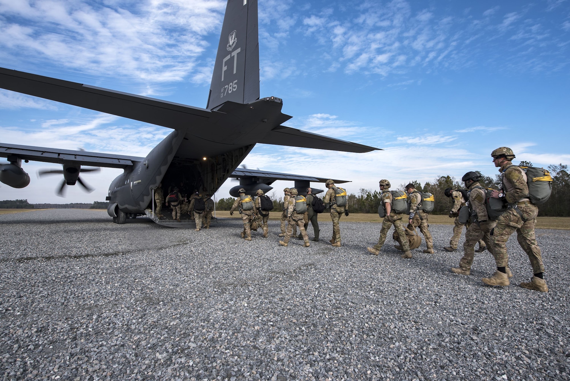 Pararescuemen from the 38th Rescue Squadron (RQS) enter an HC-130J Combat King II during a full mission profile exercise, Dec. 14, 2017, at Moody Air Force Base, Ga. During the training, the 38th RQS recovered victims while under enemy fire to prepare for future search and rescue missions and to assess their unit’s ability to work cohesively to accomplish the mission. (U.S. Air Force photo by Airman Eugene Oliver)