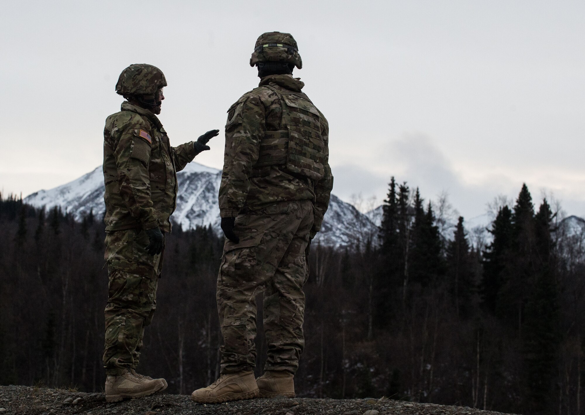 Paratroopers assigned to 3rd Battalion, 509th Parachute Infantry Regiment, 4th Infantry Brigade Combat Team (Airborne), 25th Infantry Division, U.S. Army Alaska, survey the scene before conducting M67 fragmentation grenade live fire training at Kraft Range on Joint Base Elmendorf-Richardson, Alaska, Dec. 12, 2017. A ‘pit’ noncommissioned officer supervised the Soldiers throwing grenades to maintain a safe instructional environment, enforce precaution standards, and direct them on proper handling of explosives. The fragmentation hand grenade has a lethal radius of five meters and can produce casualties up to 15 meters, dispersing fragments as far as 230 meters.