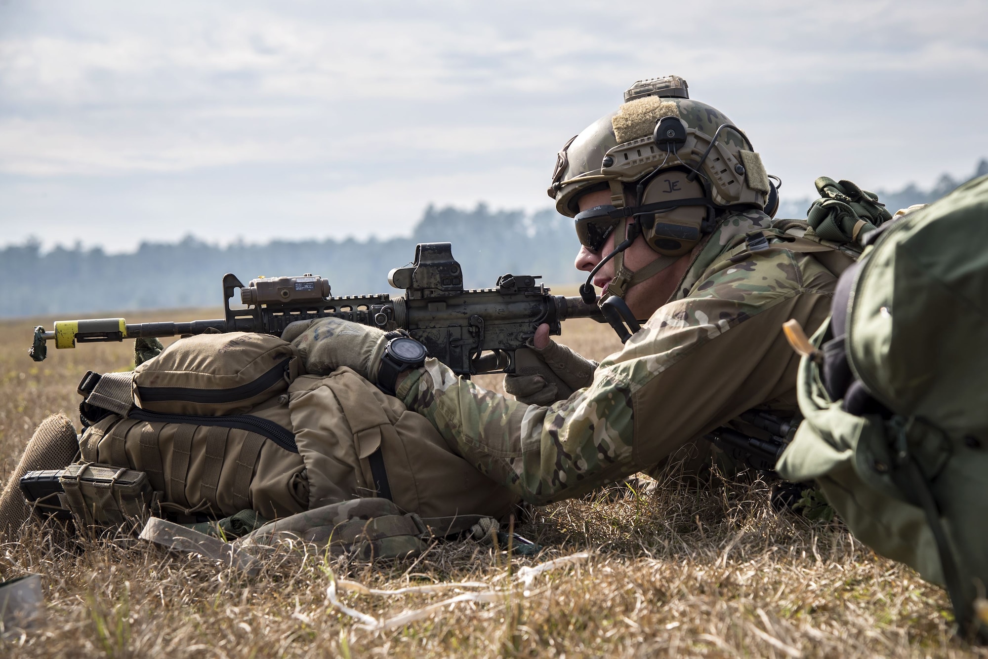 A pararescueman from the 38th Rescue Squadron (RQS) looks down the sight of his rifle during a full mission profile, Dec. 14, 2017, at Moody Air Force Base, Ga. During the training, the 38th RQS recovered victims while under enemy fire to prepare for future search and rescue missions and to assess their unit’s ability to work cohesively to accomplish the mission. (U.S. Air Force photo by Airman Eugene Oliver)