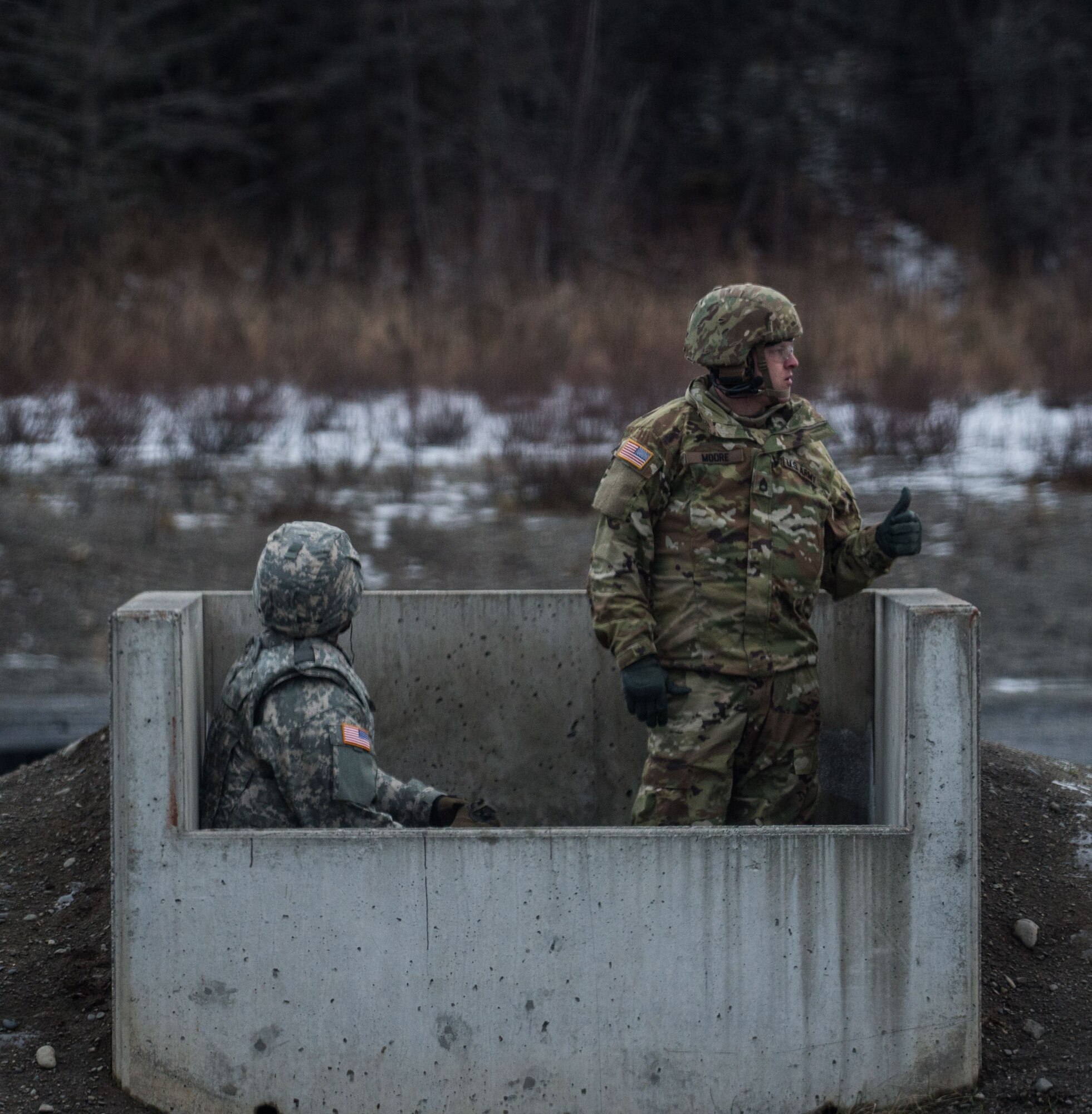 Paratroopers assigned to 3rd Battalion, 509th Parachute Infantry Regiment, 4th Infantry Brigade Combat Team (Airborne), 25th Infantry Division, U.S. Army Alaska, conduct M67 fragmentation grenade live fire training at Kraft Range on Joint Base Elmendorf-Richardson, Alaska, Dec. 12, 2017. A ‘pit’ noncommissioned officer supervised the Soldiers throwing grenades to maintain a safe instructional environment, enforce precaution standards, and direct them on proper handling of explosives. The fragmentation hand grenade has a lethal radius of five meters and can produce casualties up to 15 meters, dispersing fragments as far as 230 meters.