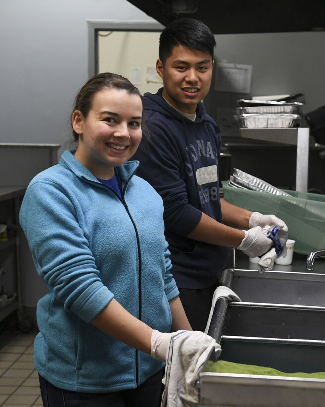 Members of the 911th Aeromedical Evacuation Squadron wash dishes at Jubilee Soup Kitchen, Pittsburgh, Pa., December 11, 2017. Jubilee Soup Kitchen is a nonprofit organization designed to provide community support through meals 365-days a year. (U.S. Air Force photo by Senior Airman Beth Kobily)