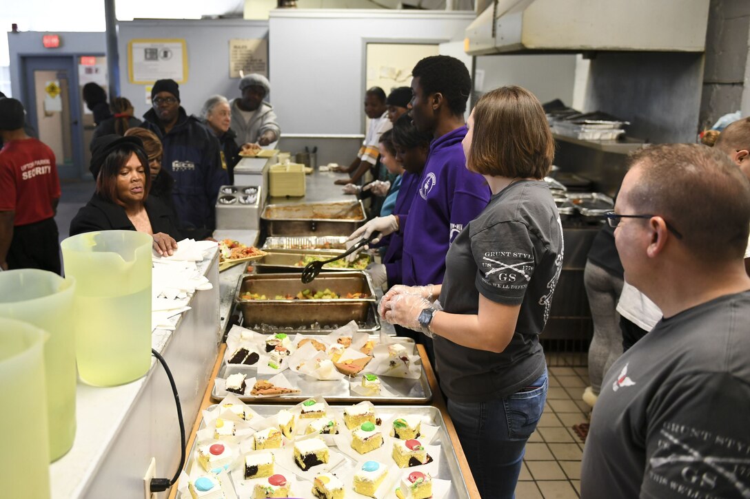 Members of the 911th Aeromedical Evacuation Squadron serve a meal at Jubilee Soup Kitchen, Pittsburgh, Pa., December 11, 2017. Jubilee Soup Kitchen is a nonprofit organization designed to provide community support through meals 365-days a year. (U.S. Air Force photo by Senior Airman Beth Kobily)