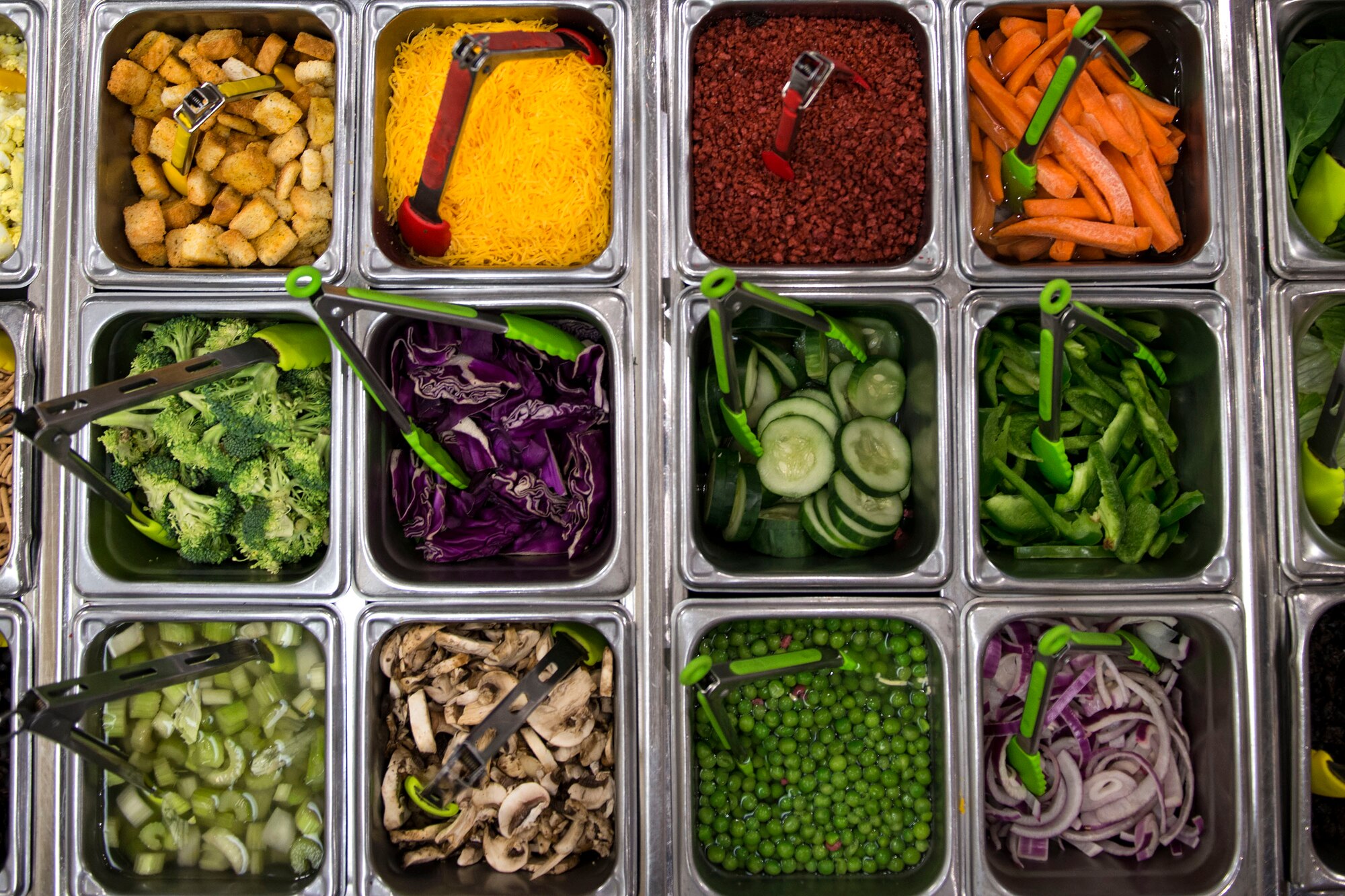 Salad toppings rest in a salad bar in the Georgia Pines Dining Facility (DFAC), Dec. 12, 2017, at Moody Air Force Base, Ga. Through teamwork, adaption and striving for excellence, the Georgia Pines DFAC Airmen are able to ensure Team Moody is fed and ready to finish the fight. (U.S. Air Force Base photo by Airman 1st Class Erick Requadt)