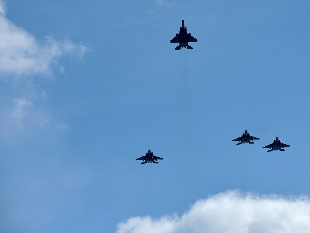 F-15s Fly the Missing Man Formation