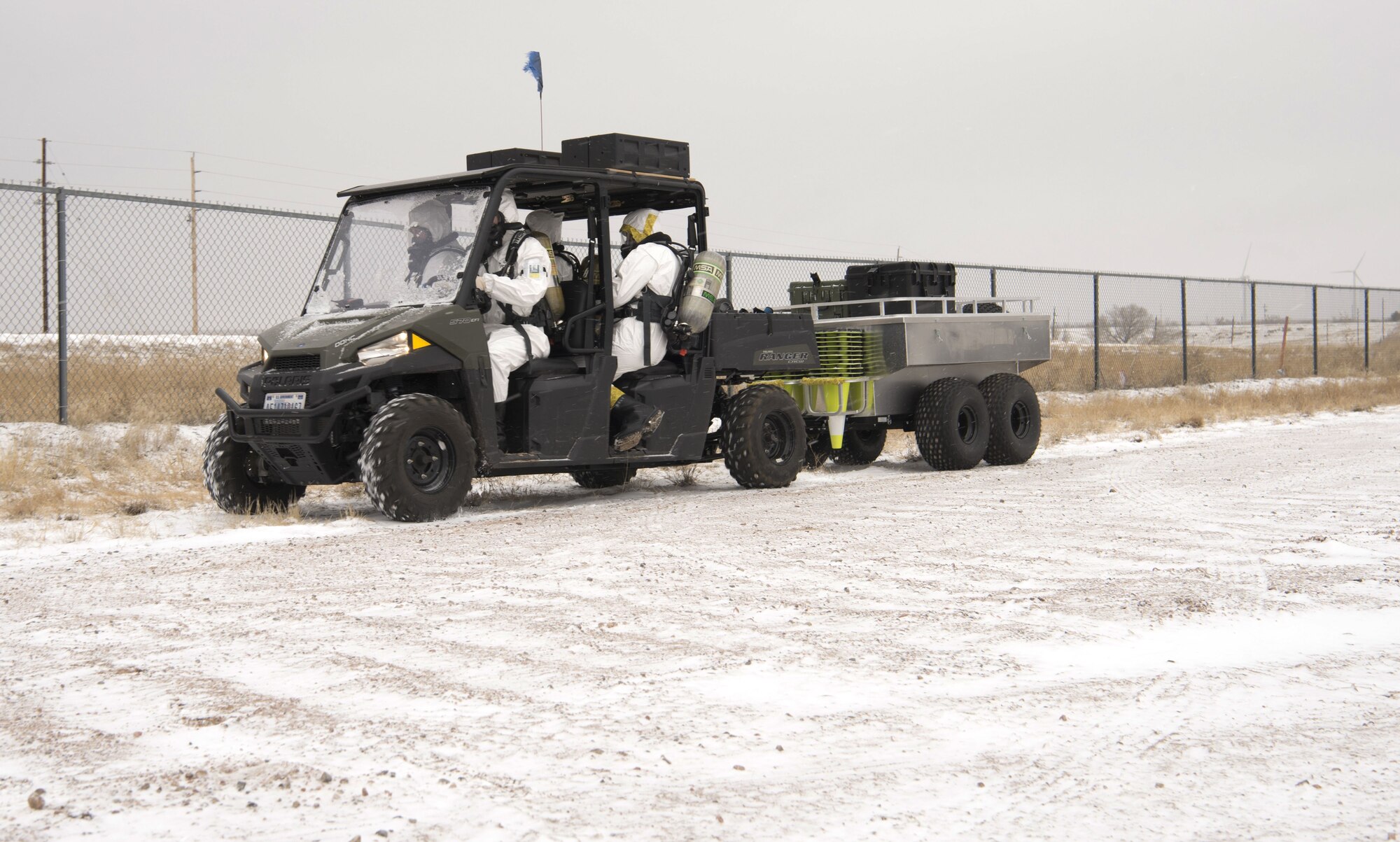 An Explosive Ordnance Disposal team proceeds into the cordoned area during an exercise on F.E. Warren Air Force Base, Wyo., Dec. 14, 2017. EOD is responsible for securing any explosive material during nuclear incidents. (U.S. Air Force photo by Airman 1st Class Braydon Williams)