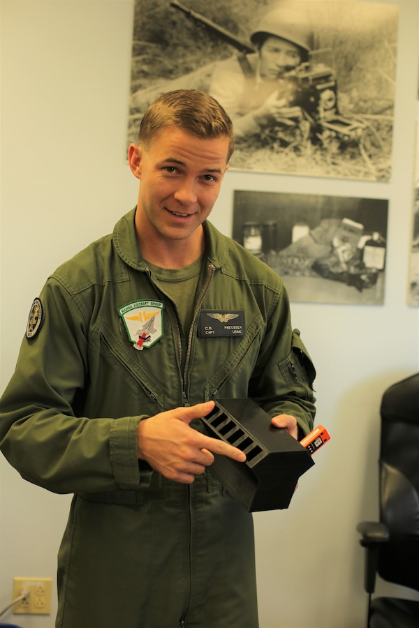 Capt. Christopher R. Preusser, the Marine Aircraft Group (MAG) 11 aviation safety officer, designed a quick-charge docking station with 12 charging ports that use one cord to connect to a power source. It’s similar to the shape or design of an engine block. The docking station is printed upside down, and the charger is one piece with 12 smaller USB cords woven inside and linked to its specific chamber. Preusser has printed six docking stations which are currently used by all of the squadrons along the Marine Corps Air Station Miramar, California, flight line.