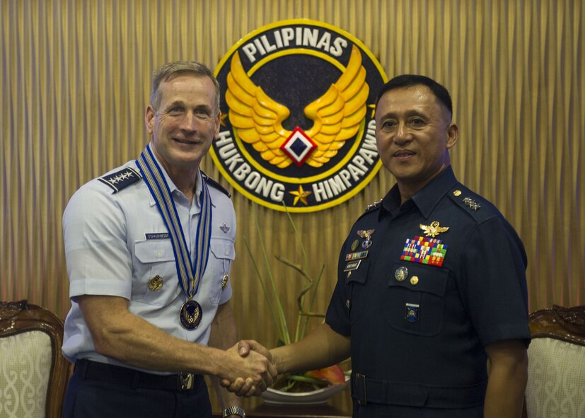 Gen. Terrence J. O’Shaughnessy, Pacific Air Forces commander and Lt. General Galileo Gerard Kintanar, Philippine Air Force commanding general, shake hands during an office call at the Philippine Air Force Headquarters, Manila, Philippines, Dec. 11.