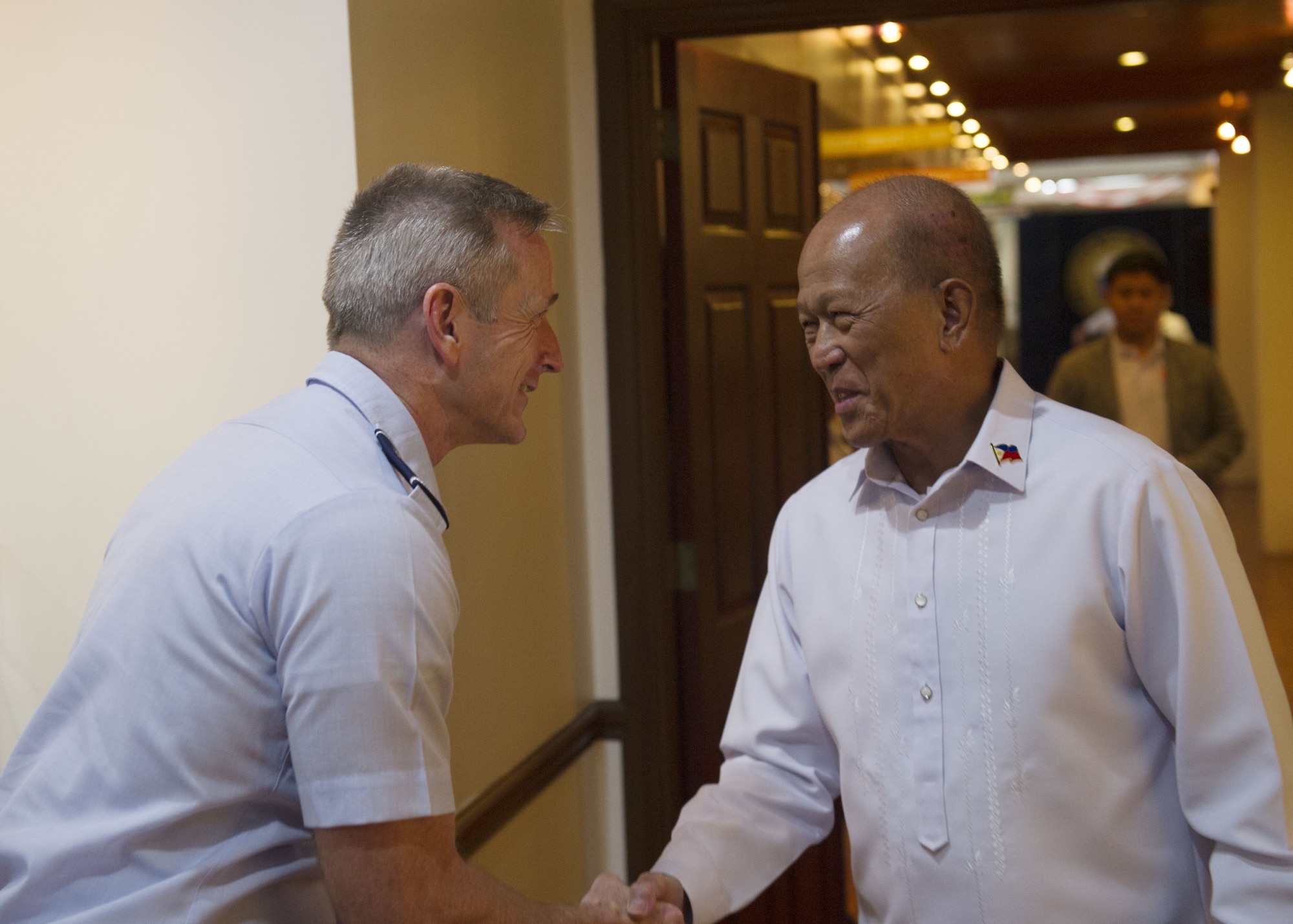 Gen. Terrence J. O’Shaughnessy, Pacific Air Forces commander, greets Delfin Lorenzana, Republic of Philippines Secretary of National Defense, at the Department of National Defense General, Camp Aguinaldo, Manila, Philippines, Dec. 11.
