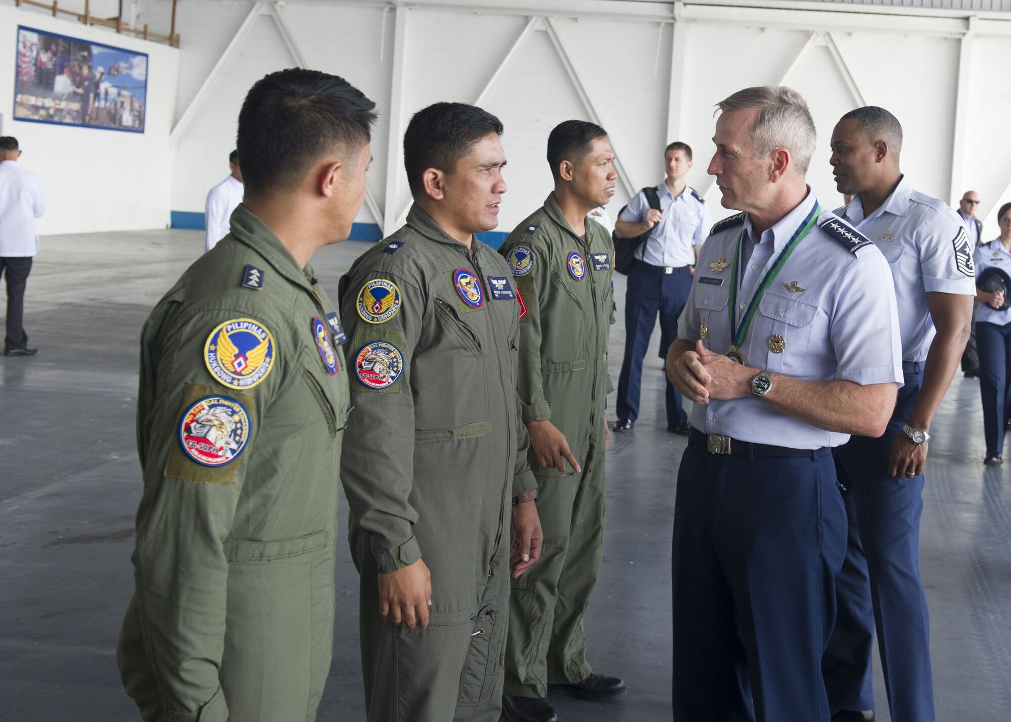 Gen. Terrence J. O’Shaughnessy, Pacific Air Forces commander, speaks with Philippines Air Force pilots during a visit to Clark Air Base, Philippines, Dec. 12.