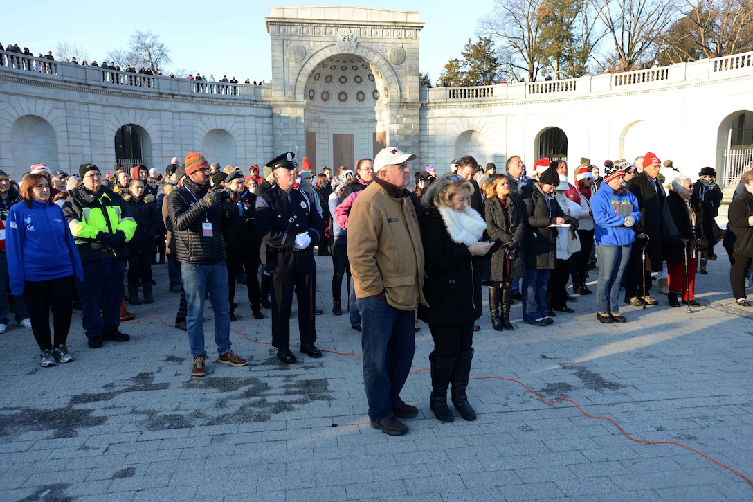 A group of people listen to a speaker.