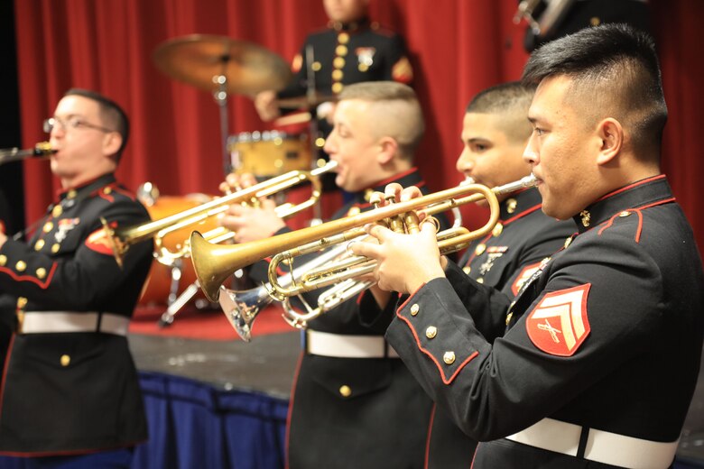 Marines with the Marine Corps New Orleans Band entertain students and teachers at various high schools in and around the St. Louis area Dec. 12-14 during its winter recruiting tour. Aside from playing music, the New Orleans, Louisiana-based Marines also educated and informed students and teachers about what life is like being a band Marine. (Official U.S. Marine Corps photo by GySgt. Bryan A. Peterson/Released)