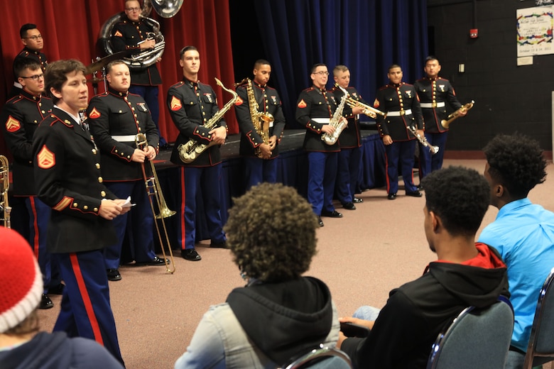 Staff Sgt. LeAnn Splitter, an assistant small ensemble leader, answers various questions from McCleur High School students, Dec. 12, in Florrissant, Missouri. Marines with the Marine Corps New Orleans Band entertained students and teachers at various high schools in and around the St. Louis area, Dec. 12-14, during its winter recruiting tour. Aside from playing music, the New Orleans, Louisiana-based Marines also educated and informed students and teachers about what life is like being a band Marine. (Official U.S. Marine Corps photo by GySgt. Bryan A. Peterson/Released)