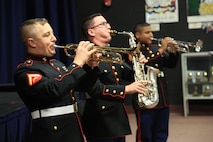 Marines with the Marine Corps New Orleans Band entertain students and teachers at various high schools in and around the St. Louis area Dec. 12-14 during its winter recruiting tour. Aside from playing music, the New Orleans, Louisiana-based Marines also educated and informed students and teachers about what life is like being a band Marine. (Official U.S. Marine Corps photo by GySgt. Bryan A. Peterson/Released)