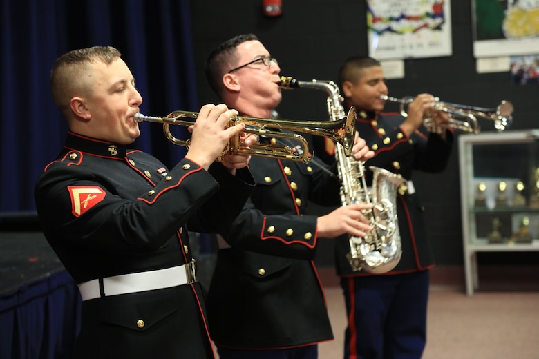 Marines with the Marine Corps New Orleans Band entertain students and teachers at various high schools in and around the St. Louis area Dec. 12-14 during its winter recruiting tour. Aside from playing music, the New Orleans, Louisiana-based Marines also educated and informed students and teachers about what life is like being a band Marine. (Official U.S. Marine Corps photo by GySgt. Bryan A. Peterson/Released)