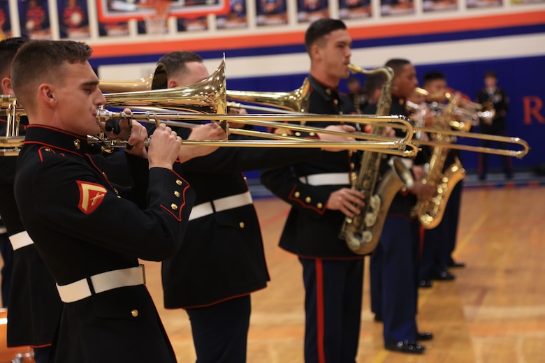 Marines with the Marine Corps New Orleans Band entertain students and teachers at various high schools in and around the St. Louis area, Dec. 12-14, during its winter recruiting tour. Aside from playing music, the New Orleans, Louisiana-based Marines also educated and informed students and teachers about what life is like being a band Marine. (Official U.S. Marine Corps photo by GySgt. Bryan A. Peterson/Released)