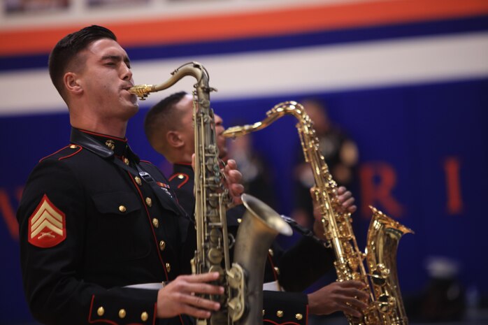 Sergeant Spencer Day plays the saxophone at Valley Park High School, Dec. 14, in Valley Park, Missouri. Marines with the Marine Corps New Orleans Band entertained students and teachers at various high schools in and around the St. Louis area, Dec. 12-14, during its winter recruiting tour. Aside from playing music, the New Orleans, Louisiana-based Marines also educated and informed students and teachers about what life is like being a band Marine. (Official U.S. Marine Corps photo by GySgt. Bryan A. Peterson/Released)