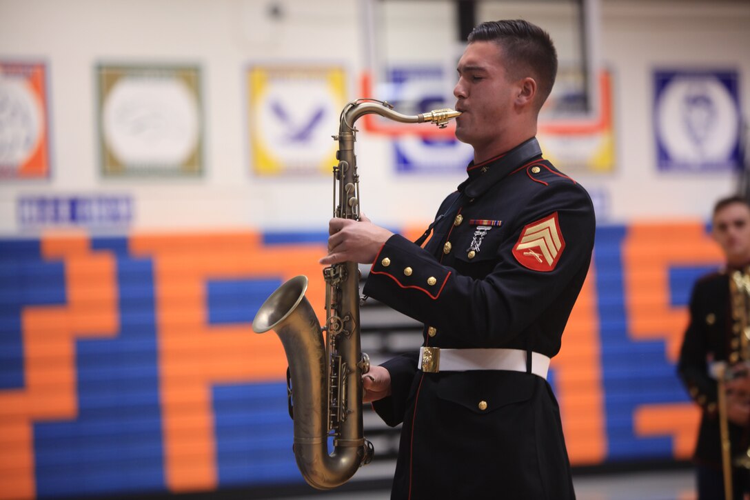 Sergeant Spencer Day plays the saxophone at Valley Park High School, Dec. 14, in Valley Park, Missouri. Marines with the Marine Corps New Orleans Band entertained students and teachers at various high schools in and around the St. Louis area Dec. 12-14 during its winter recruiting tour. Aside from playing music, the New Orleans, Louisiana-based Marines also educated and informed students and teachers about what life is like being a band Marine. (Official U.S. Marine Corps photo by GySgt. Bryan A. Peterson/Released)