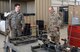 U.S. Air Force Lt. Gen. Jeffery Harrigian, U.S. Air Forces Central Command Commander, talks with Senior Airman Metthew Self, 100th Expeditionary Fighter Squadron consolidated tool kit custodian, at the 407th Air Expeditionary Group in Southwest Asia, Dec. 14, 2017. Self told Harrigian the hardest part of getting the 100th EFS setup was setting the work benches in place due to their weight. (U.S. Air Force photo by Staff Sgt. Joshua Edwards/Released)