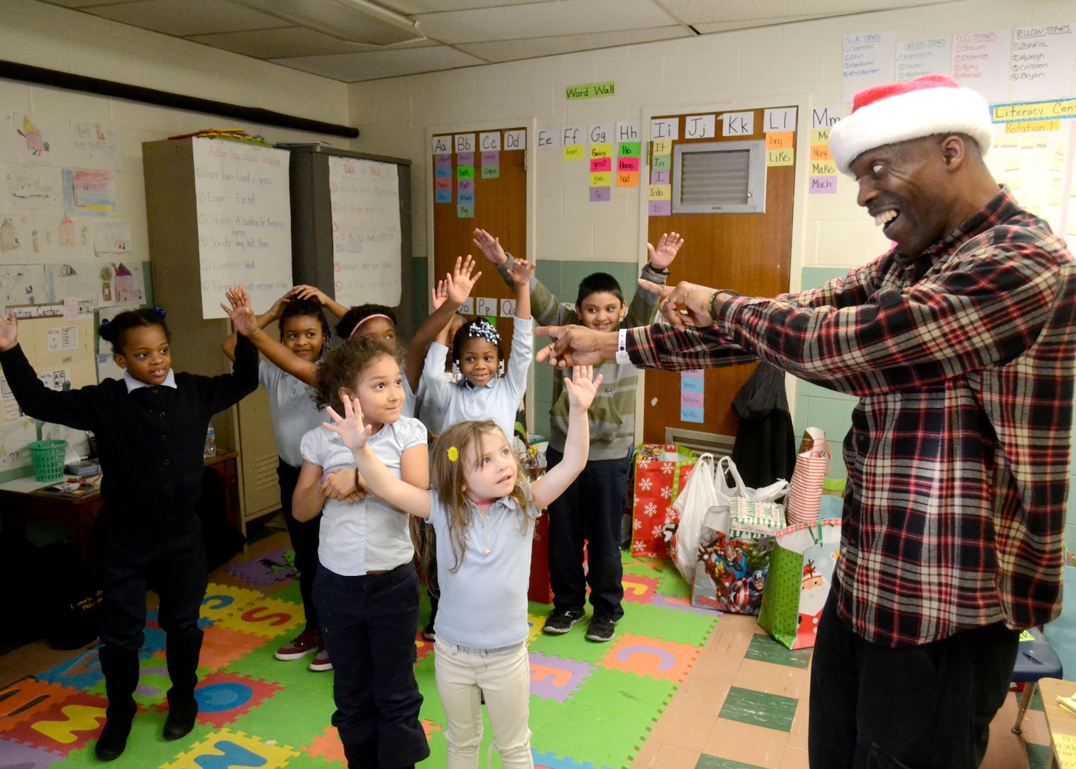 Troop Support employees bring holiday cheer to local students