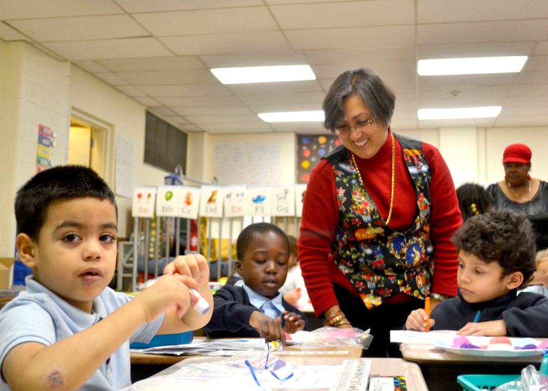 Troop Support employees bring holiday cheer to local students