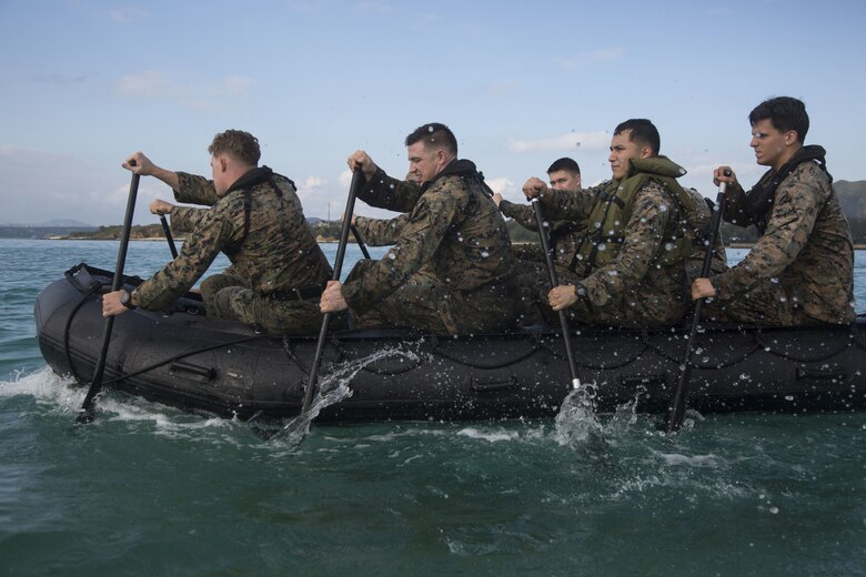 U.S. Marines with 3rd Reconnaissance Battalion paddle in a zodiac boat on Camp Schwab during the 3rd Reconnaissance Battalion annual Warrior Challenge in Okinawa, Japan, December 15, 2017. The events included the basic skills and knowledge of the reconnaissance operations fields.