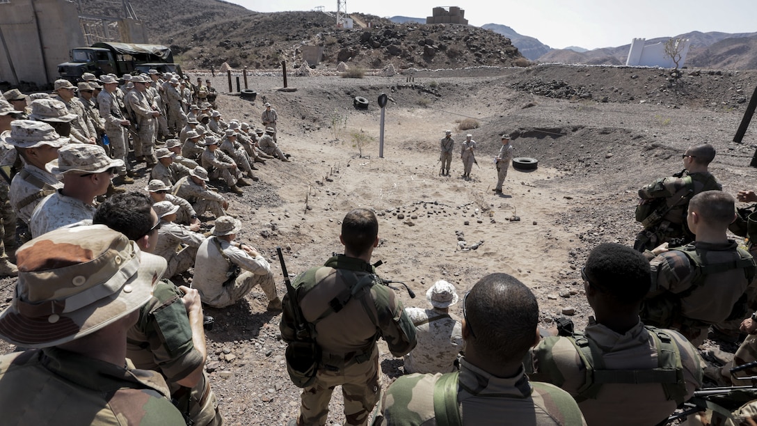 171214-M-QL632-004 DJIBOUTI, Djibouti (Dec. 14, 2017) – U.S. Marines and French military forces receive instructions prior to engaging in Alligator Dagger, a bilateral combat rehearsal. Alligator Dagger, led by Naval Amphibious Force, Task Force 51/5th Marine Expeditionary Expedition Brigade, is a dedicated, bilateral combat rehearsal that combines U.S. and French forces to practice, rehearse and exercise integrated capabilities available to U.S. Central Command both afloat and ashore. (U.S. Marine Corps photo by Staff Sgt. Vitaliy Rusavskiy/Released)