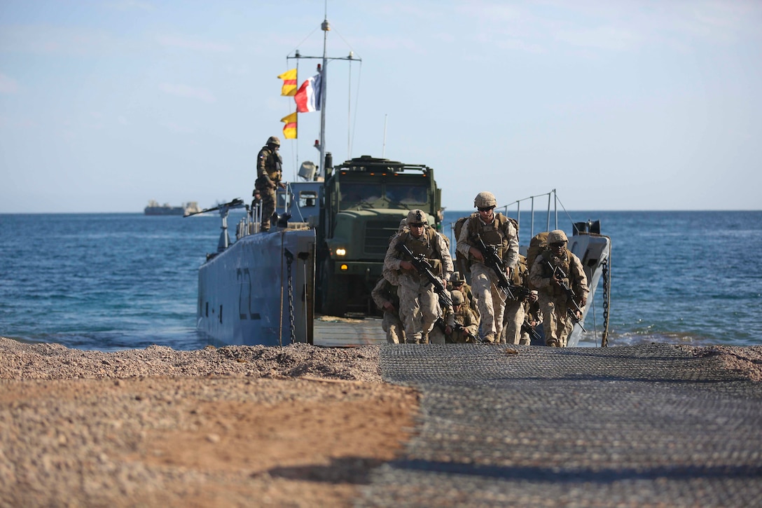U.S. Marines with the 15th Marine Expeditionary Unit and French Navy sailors offload from a French landing catamaran at Arta Beach, Djibouti, while conduction amphibious training  during Alligator Dagger. Alligator Dagger, led by Naval Amphibious Force, Task Force 51/5th Marine Expeditionary Expedition Brigade, is a dedicated, bilateral combat rehearsal that combines U.S. and French forces to practice, rehearse and exercise integrated capabilities available to U.S. Central Command both afloat and ashore.