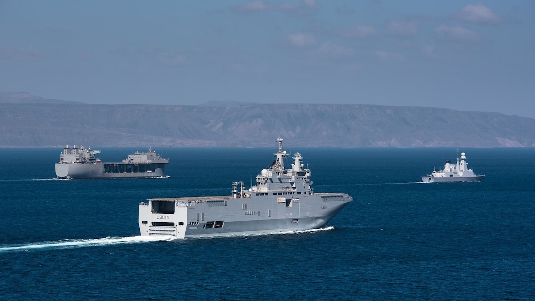 French navy Horizon-class frigate Chevalier Paul (D621) and French navy Mistral-class amphibious assault ship LHD Tonnerre (L9014) line up for a photo with the USS Lewis B. Puller (ESB 3) during Alligator Dagger, a combat rehearsal off the coast of Djibouti. The Expeditionary Mobile Base platform supports Naval Amphibious Force, Task Force 51/5th Marine Expeditionary Brigade’s (TF 51/5) diverse missions that include crisis response, airborne mine countermeasures, counter-piracy operations, maritime security operations and humanitarian aid/disaster relief missions while enabling TF 51/5 to extend its expeditionary presence in the world’s most volatile regions.