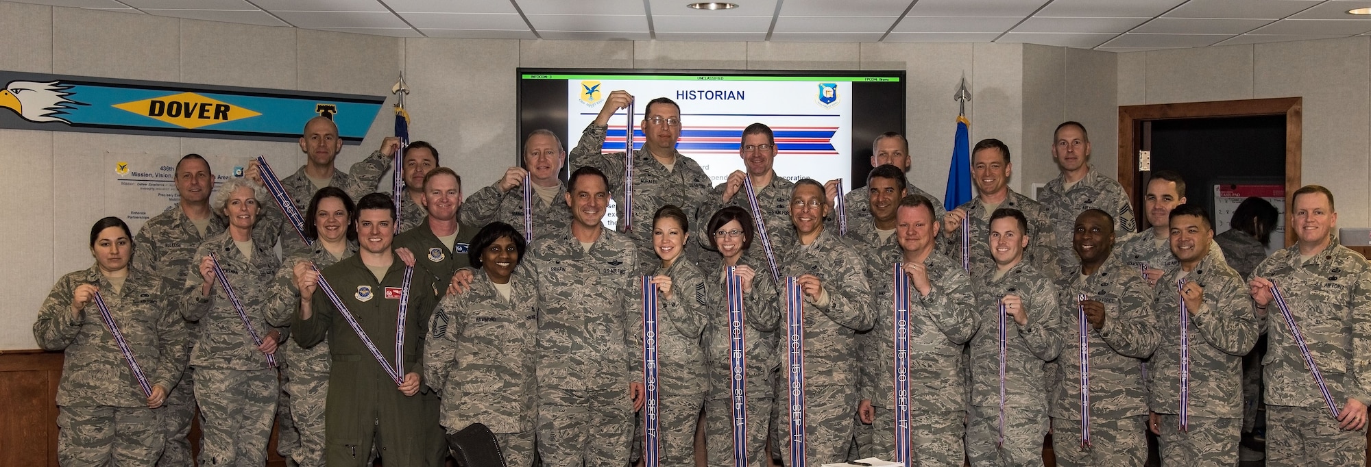 436th Airlift Wing receives streamers commemorating the wing’s recent Air Force Outstanding Unit Award
