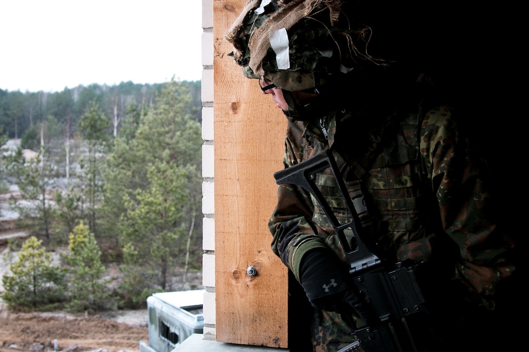 A soldiers scans the terrain.