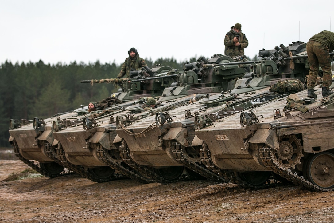 German soldiers position tanks during an exercise.