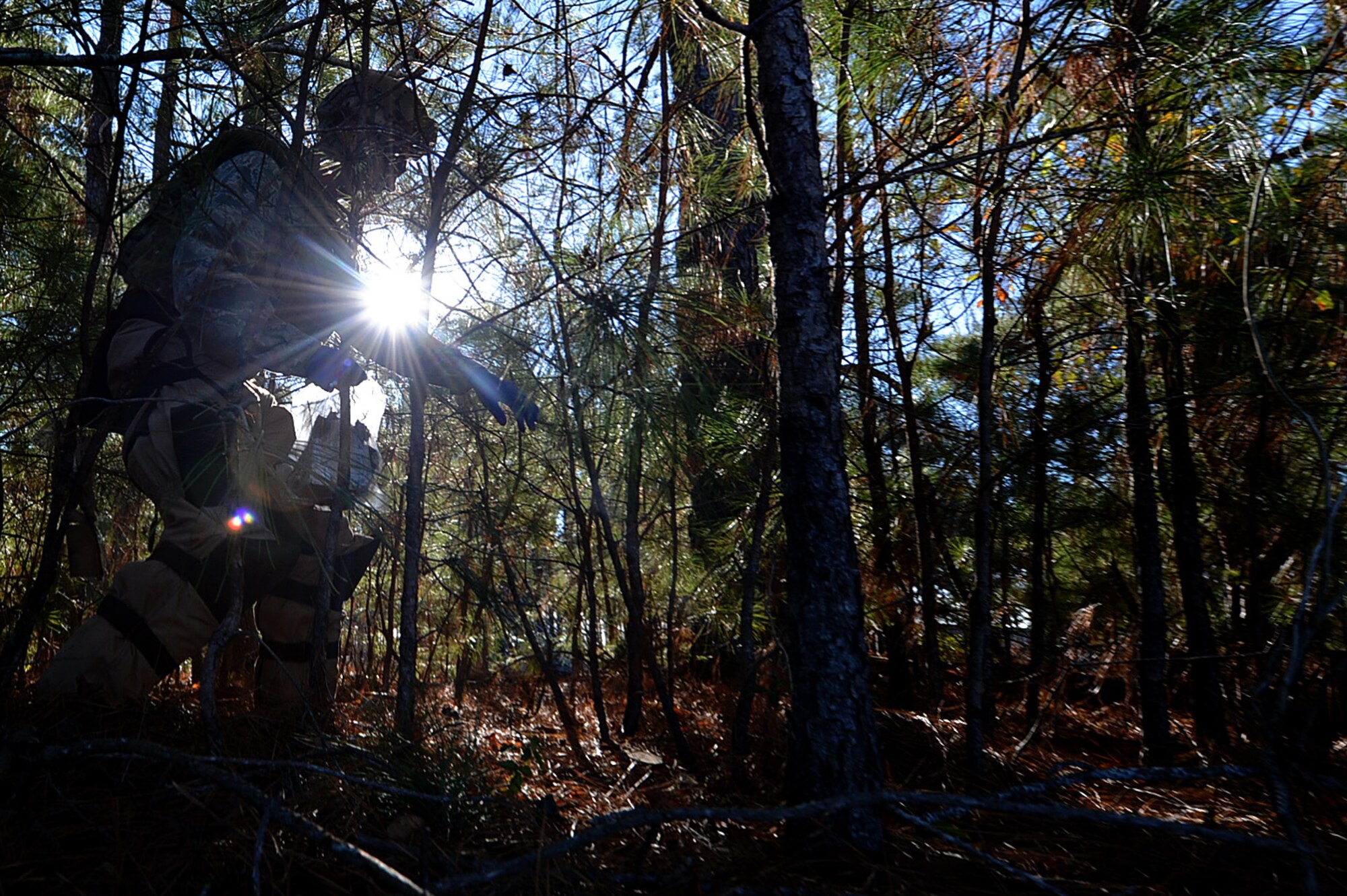 A U.S. Airman assigned to the 20th Civil Engineer Squadron explosive ordnance disposal (EOD) flight searches for dummy improvised explosive device (IED) debris at Shaw Air Force Base, S.C., Dec. 14, 2017.