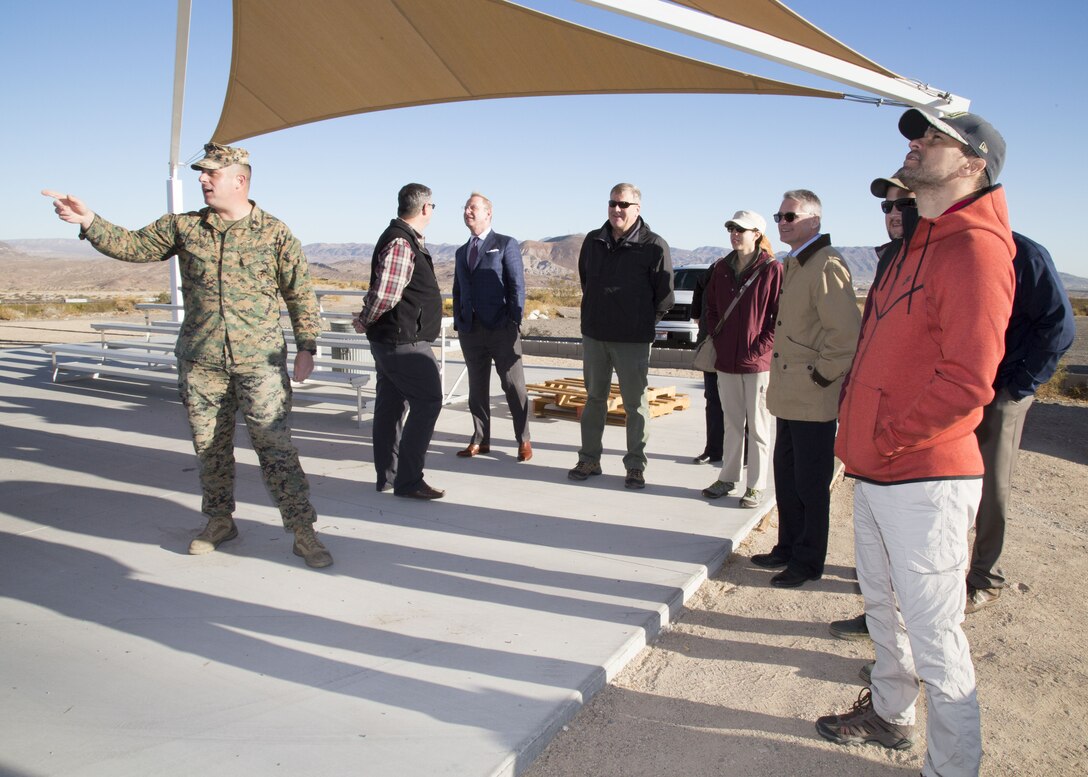 Staff Sgt. Nicholas Hensley, operations chief, explains range operations and functionality to members of the Defense Acquisition University as part of their tour of Marine Corps Logistics Base Barstow, Calif., Nov. 30.