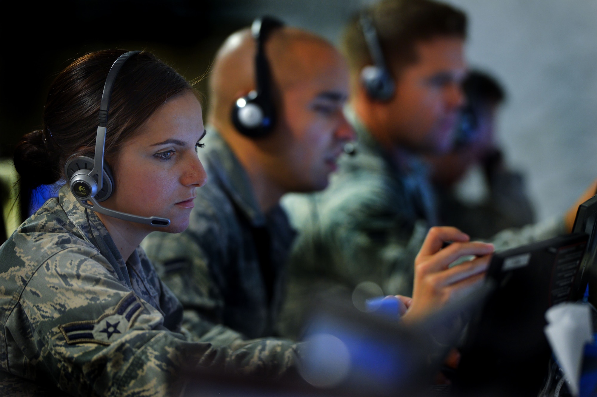 U.S. Air Force Airman 1st Class Lizandra Montero, 337th Air Control Squadron pilot simulator, controls threat scenarios projected to a training audience of U.S. military and allied armed forces members during Exercise Eagle Resolve 2013 in the Regional Air Operations Center in Doha, Qatar, April 24. When the 33rd Fighter Wing acquired it's current training mission under Air Education and Training Command it absorbed the 337 ACS, the Air Force's only Air Battle Manager school house. (U.S. Air Force photo by Kenny Holston/Released)
