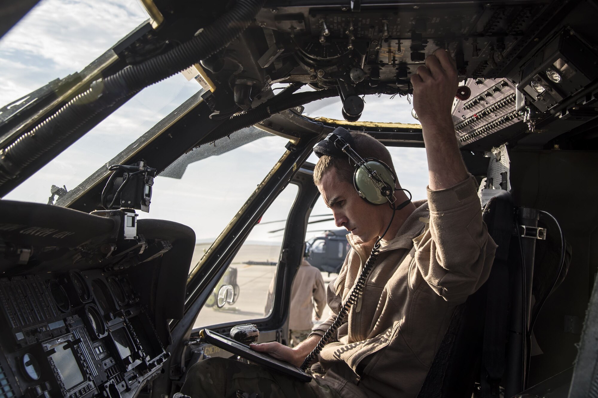 Staff Sgt. Dustin Stephens, 723d Aircraft Maintenance Squadron (AMXS) crew chief, performs an operations check on an HH-60G Pave Hawk, Dec. 15, 2017, at Moody Air Force Base, Ga. Members from the 723d Aircraft Maintenance Squadron (AMXS) and 23d Civil Engineer Squadron (CES) participated in a training day to help improve their readiness and get extra practice at their crafts. The AMXS performed maintenance on helicopters and the CES conducted rescue operations by extinguishing a mock fire within an HH-60G Pave Hawk and extracting injured victims. (U.S. Air Force photo by Airman Eugene Oliver)