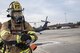A firefighter from the 23d Civil Engineer Squadron (CES) holds a fire hose, Dec. 15, 2017, at Moody Air Force Base, Ga.  Members from the 723d Aircraft Maintenance Squadron (AMXS) and 23d Civil Engineer Squadron (CES) participated in a training day to help improve their readiness and get extra practice at their crafts. The AMXS performed maintenance on helicopters and the CES conducted rescue operations by extinguishing a mock fire within an HH-60G Pave Hawk and extracting injured victims. (U.S. Air Force photo by Airman Eugene Oliver)
