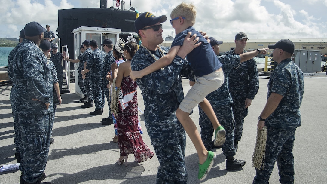 A sailor reunites with his son.