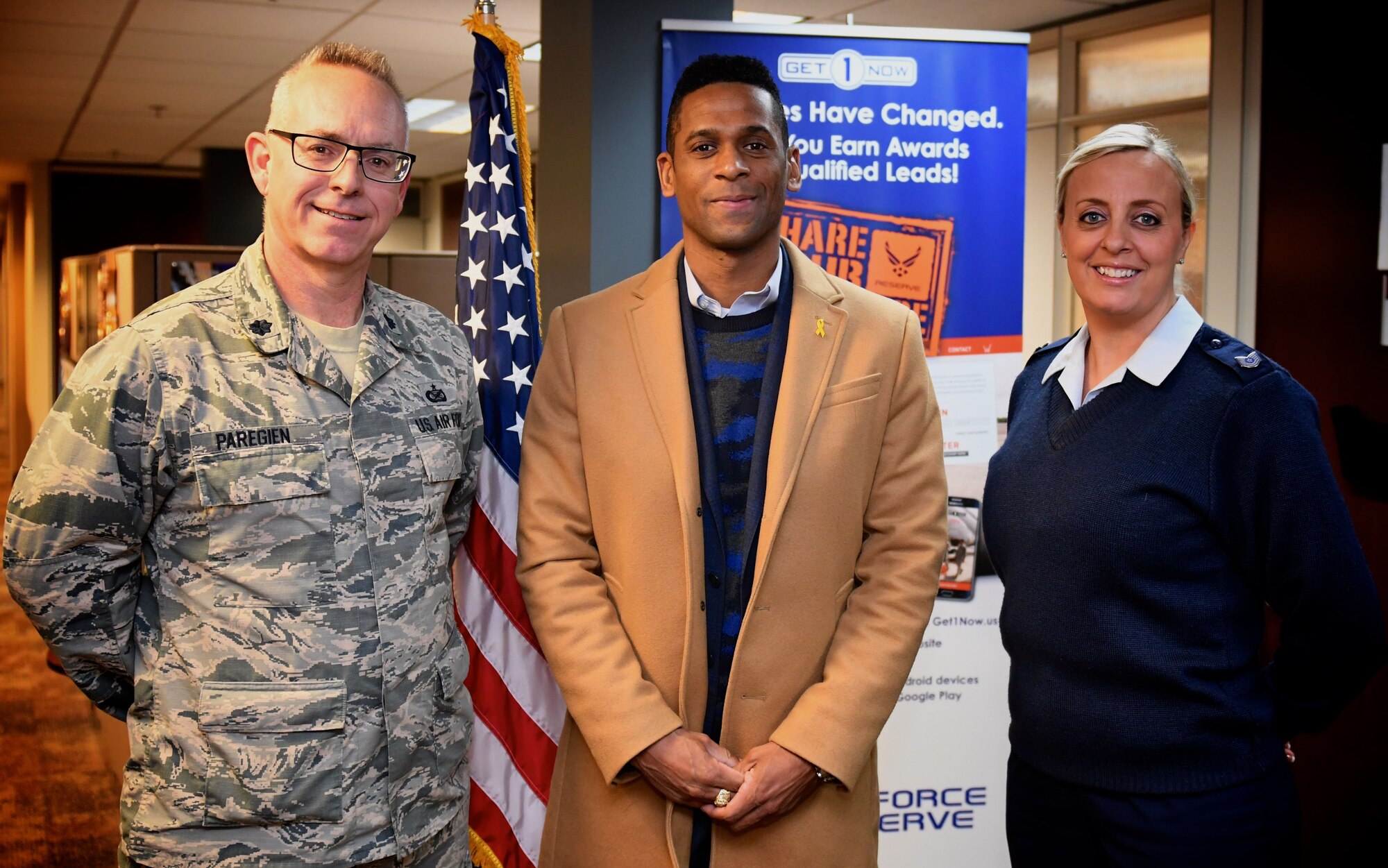 Patriotism...some wave a flag, some join the military, and these moments in life are extra special when a person raises their right hand and agrees to "support and defend the Constitution of the United States, against all enemies, foreign and domestic".  Here, 932nd Airlift Wing Chief of Public Affairs, Lt. Col. Stan Paregien stands by the American flag immediately following the oath of enlistment for Erik Bedenfield, who enlisted into the United States Air Force Reserve at Scott Air Force Base, Illinois. The ceremony took place Dec. 14, 2017, in the 932nd AW headquarters, and was facilitated by the background work of recruiter Tech. Sgt. Nikki Seibel, seen here witnessing the event next to Bedenfield. For others interested in joining they can contact the recruiting office at (618)-229-7077 or toll free 1-800-257-1212.  (U.S. Air Force photo by Master Sgt. Christopher Parr)