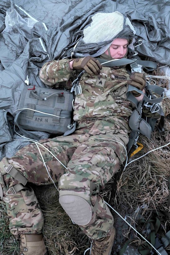 A soldiers begins parachute recovery.