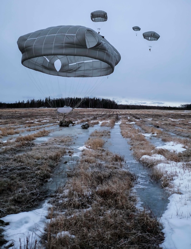 Army soldiers make a ice landing during training.