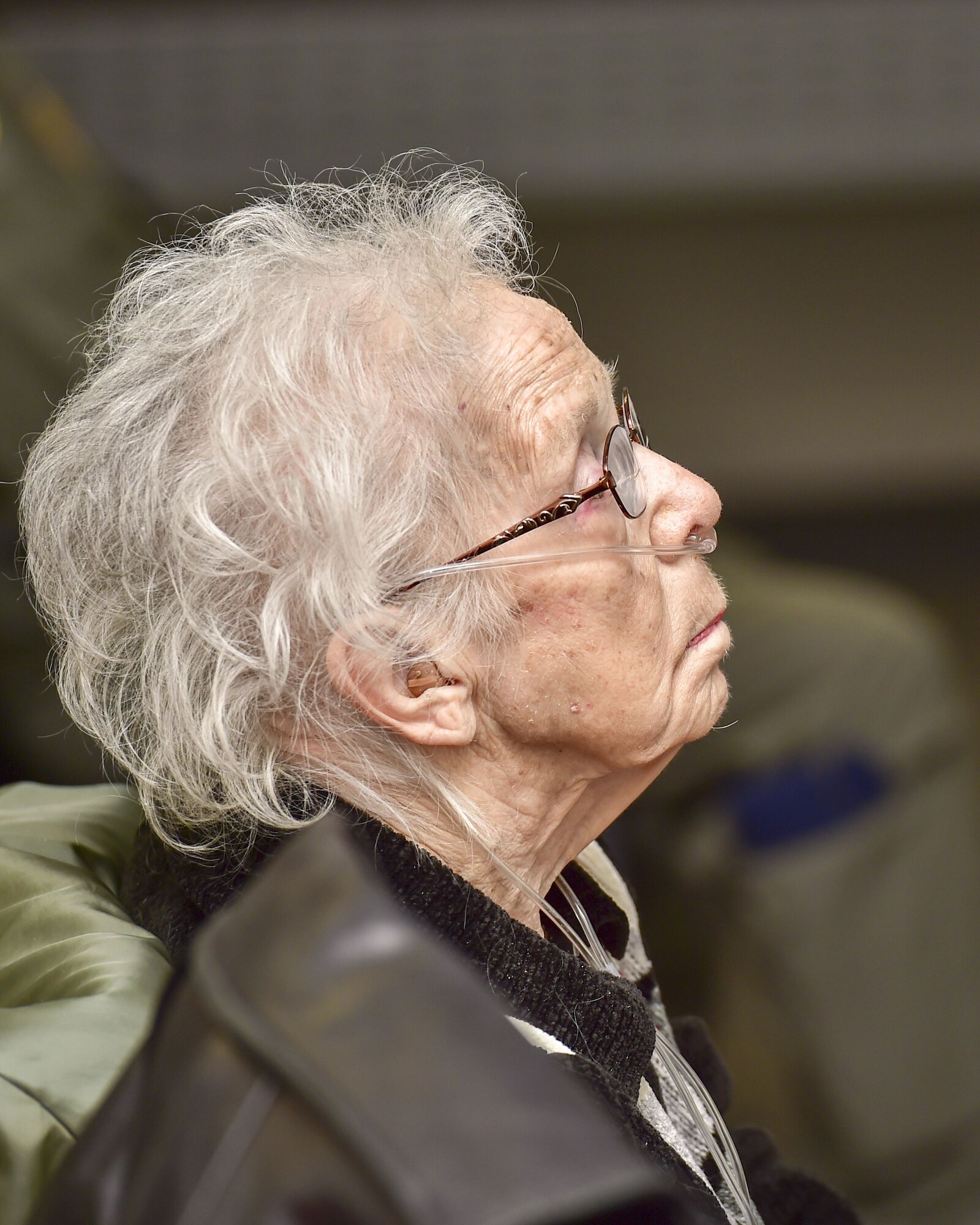 Col. Dan Sarachene (center), 910th Airlift Wing commander, greets Mary "Laverne" Kubli, widow of Fred Kubli Jr., during a building dedication ceremony here, Dec. 15, 2017.