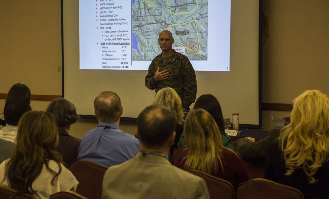 U.S. Marine Corps Col. David A. Suggs, the commanding officer of Marine Corps Air Station (MCAS) Yuma, speaks to various teachers and educational leaders from the local community during the Military K-12 Education Meet and Greet at the Sonoran Pueblo on MCAS Yuma, Ariz., Nov. 29, 2017. Yuma educational leaders received a brief on the air station's mission and how its continuing growth will impact their schools.