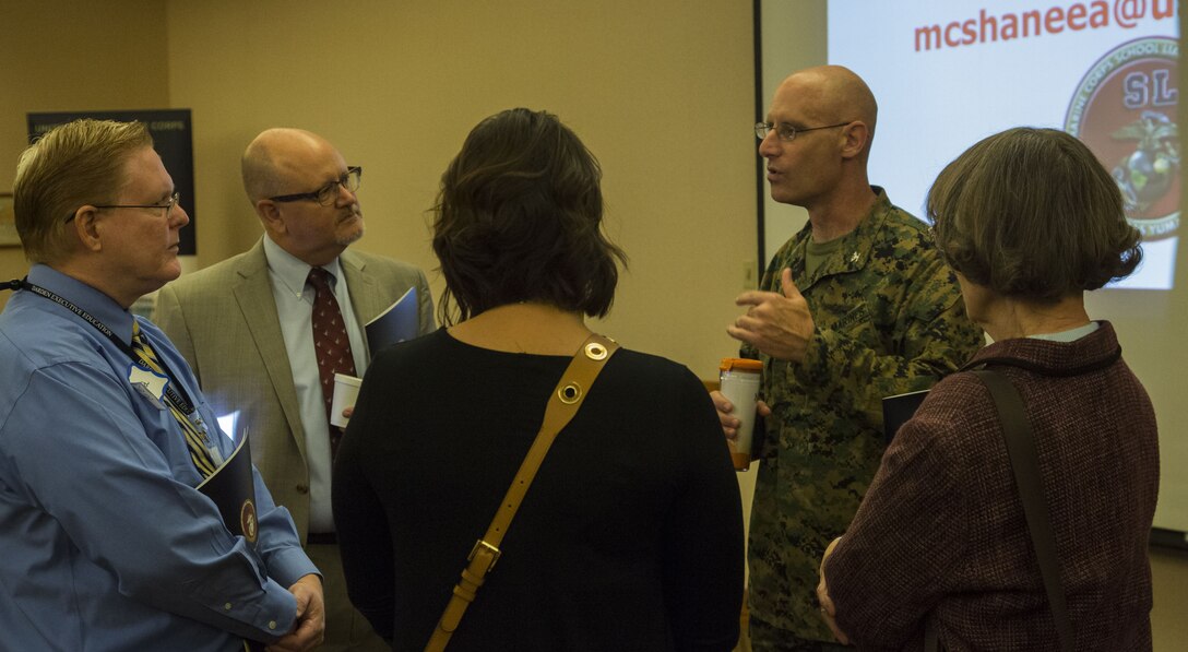U.S. Marine Corps Col. David A. Suggs, the commanding officer of Marine Corps Air Station (MCAS) Yuma, speaks to a group of teachers and educational leaders from the local community during the Military K-12 Education Meet and Greet at the Sonoran Pueblo on MCAS Yuma, Ariz., Nov. 29, 2017. Yuma educational leaders received a brief on the air station's mission and how its continuing growth will impact their schools.