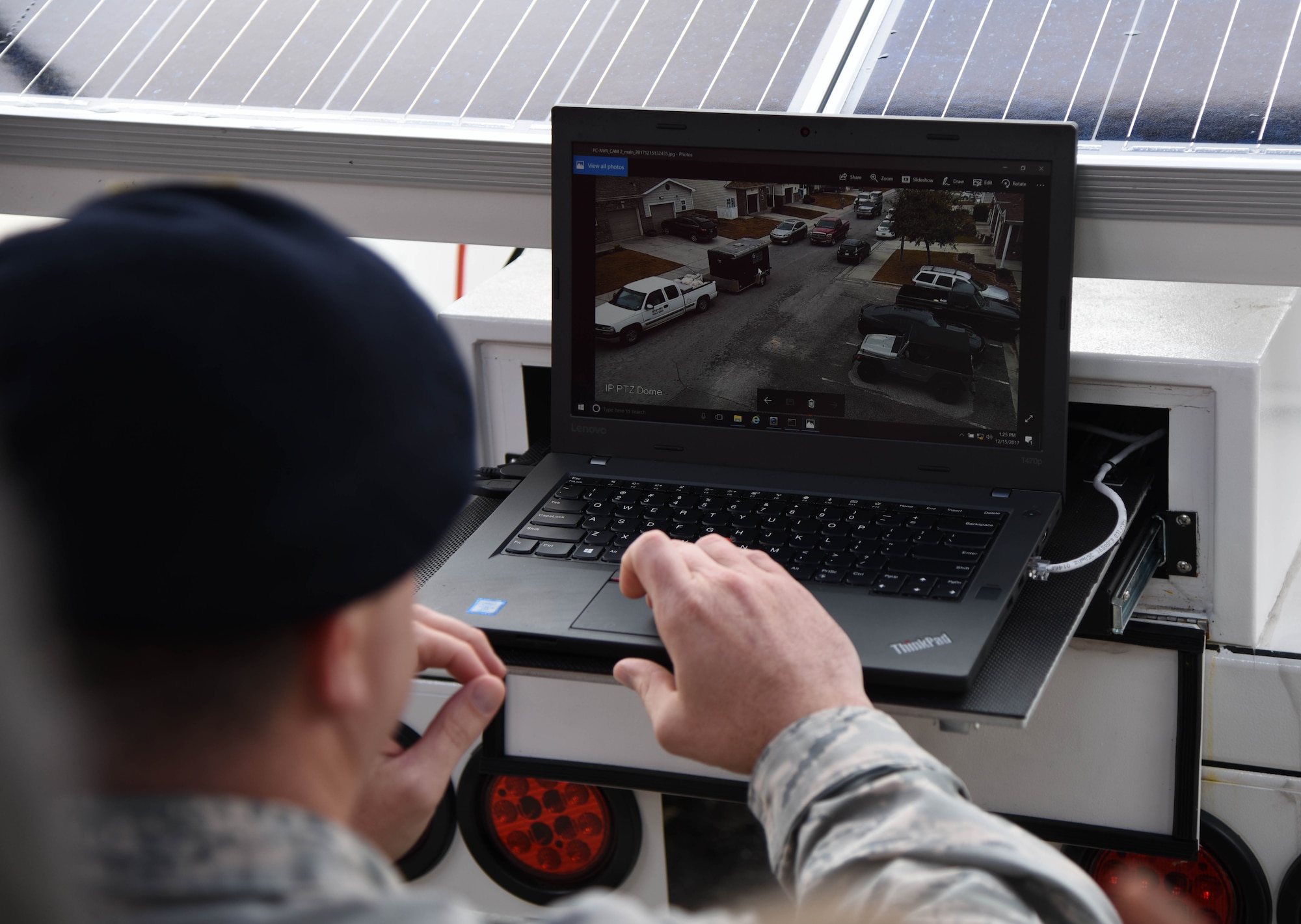 Tech. Sgt. Jared Miller, 81st Security Forces unit department manager, provides a demonstration during a security cameras ribbon cutting ceremony at West Falcon Dec. 15, 2017, in Biloxi, Mississippi. The ceremony highlighted new security cameras in the housing area as an additional layer of deterrence to criminal activity and allows for a 24/7 detection system 365 days a year. (U.S. Air Force photo by Kemberly Groue)